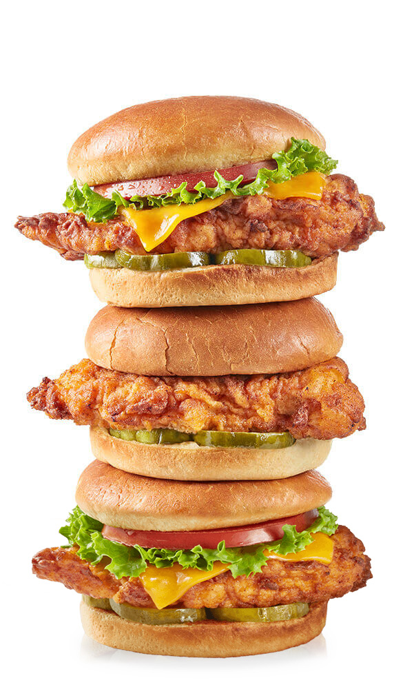 Delicious fried chicken sandwiches stacked on top of one another like a tasty tower.